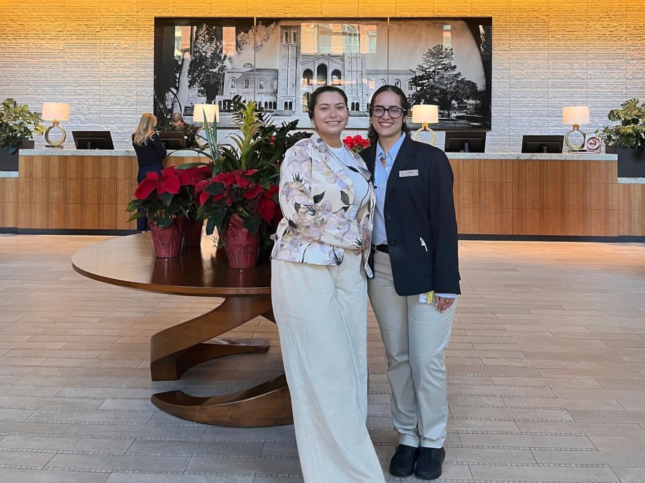 Guests posing happily in the Luskin Conference Center main entrance