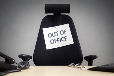 Out of office sign on a chair