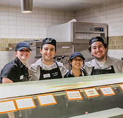 Students workers in a dining hall