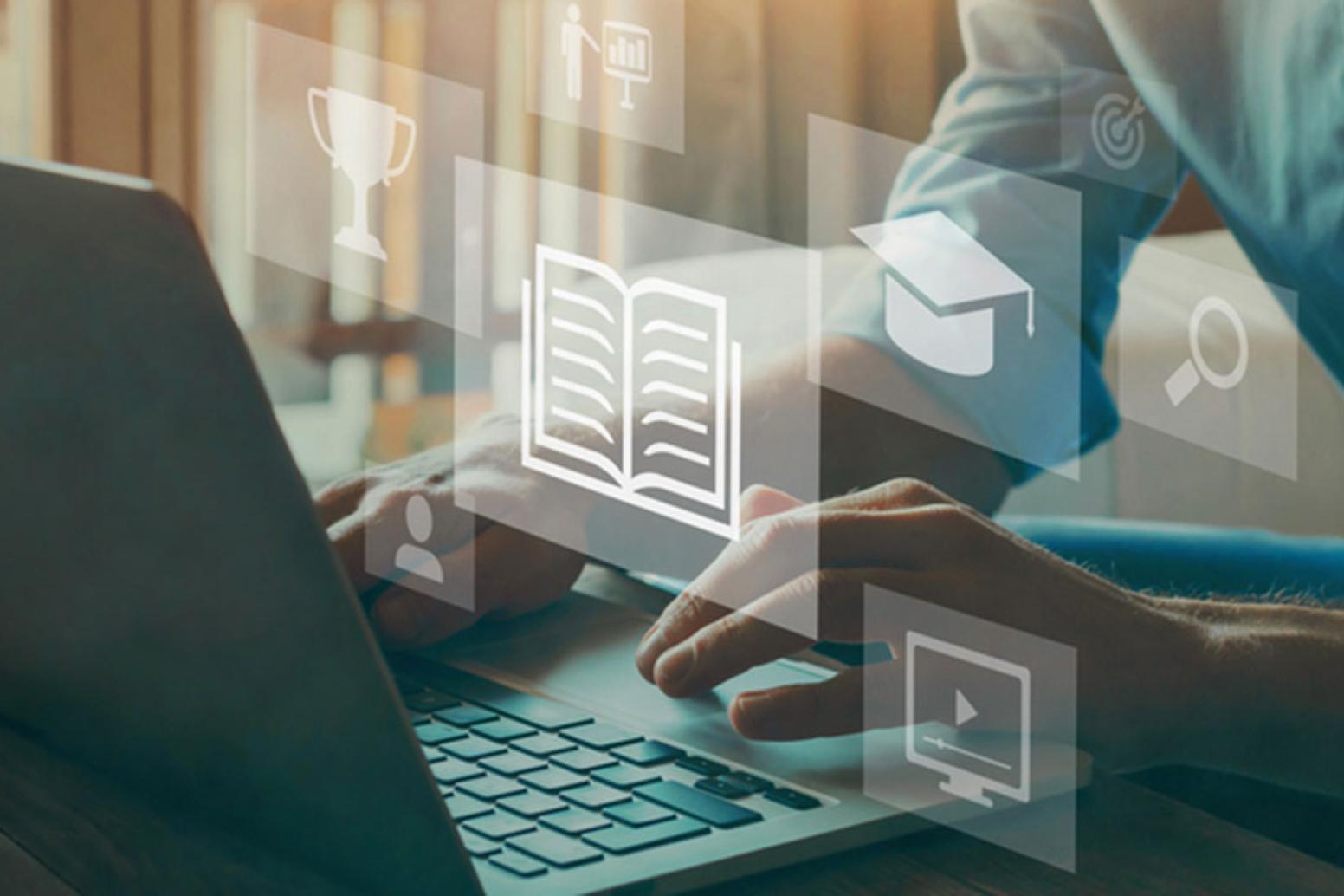 A digital image - icons signifying learning, float above a laptops keyboard being used by an individual