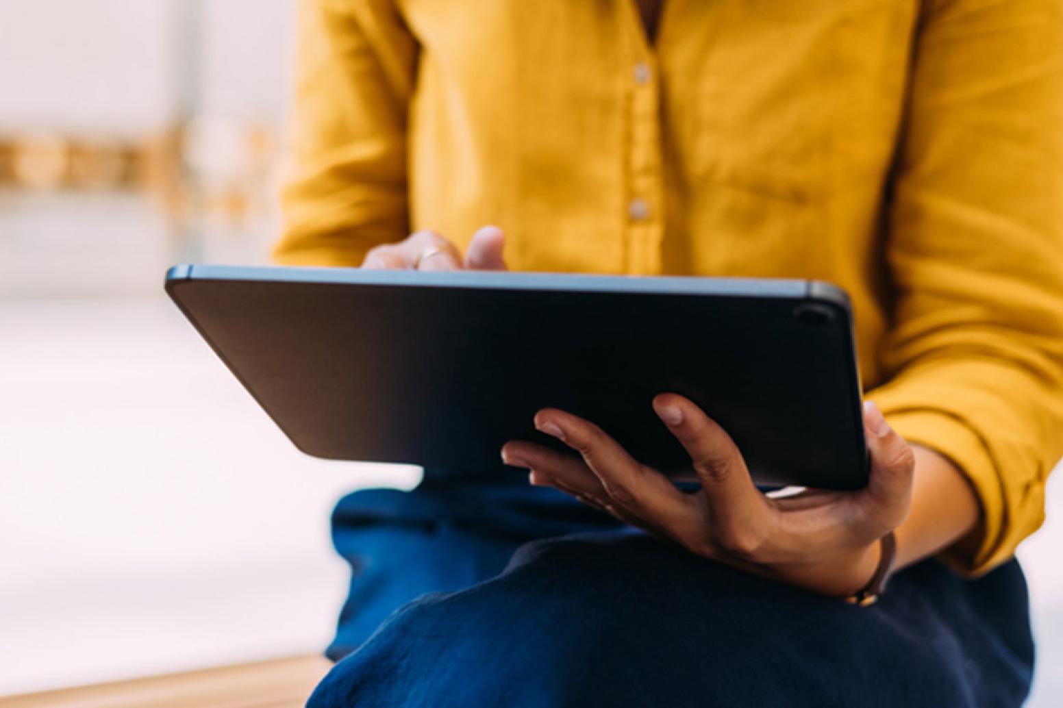 A bruin enjoys linkedin learning on their laptop