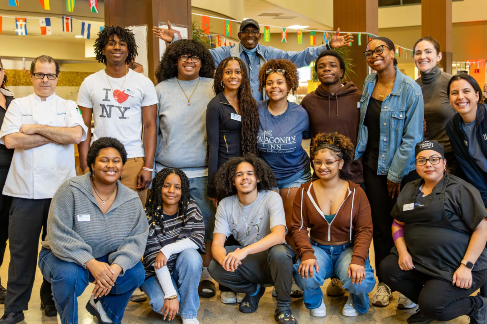 Group posing for the camera on campus
