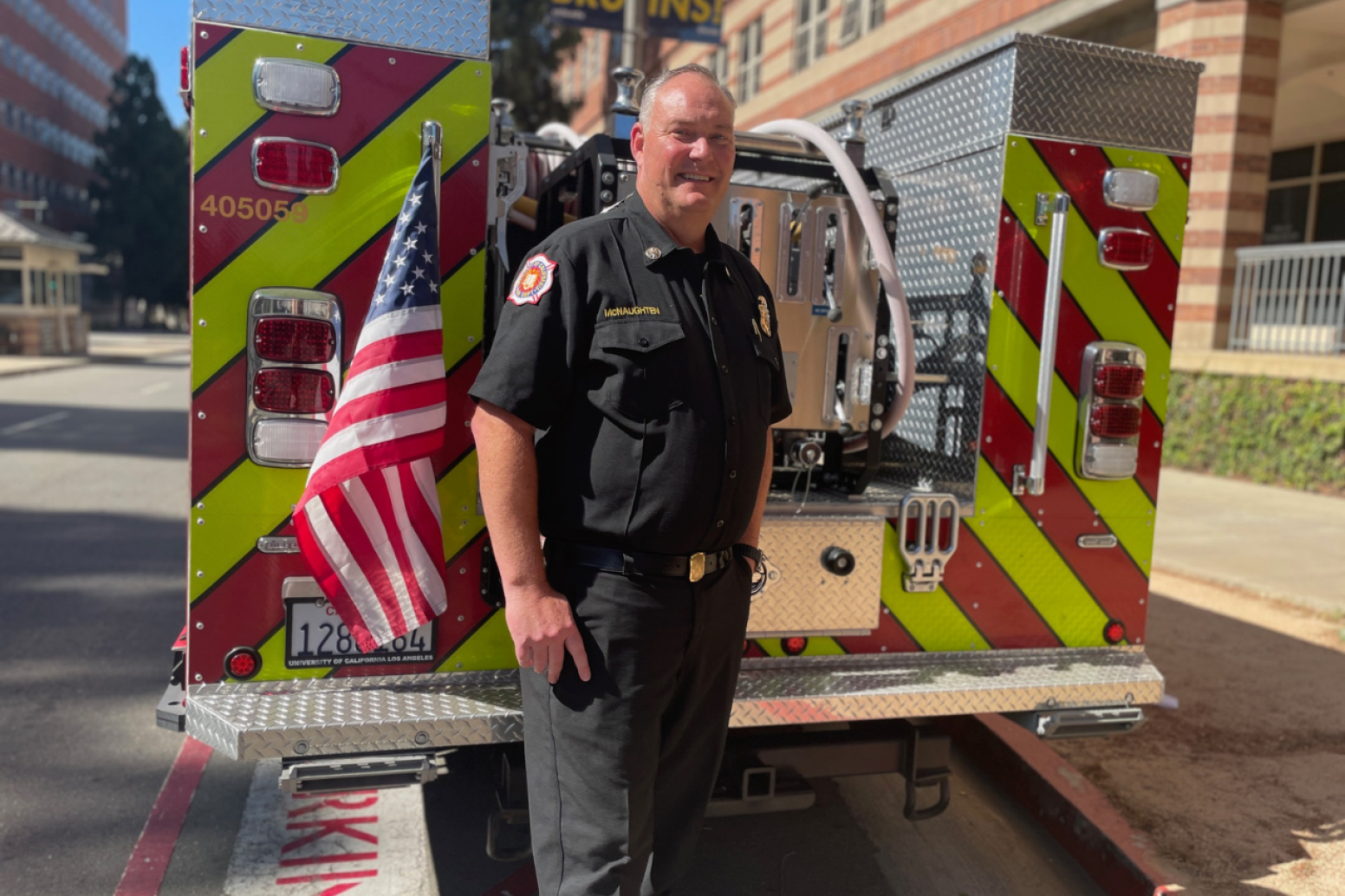 Steve McNaughten in front of a fire vehicle
