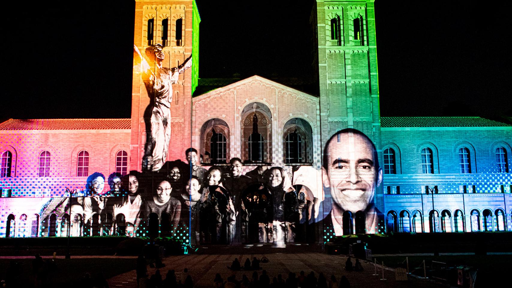 Royce hall lit in rainbow hues and black bruins