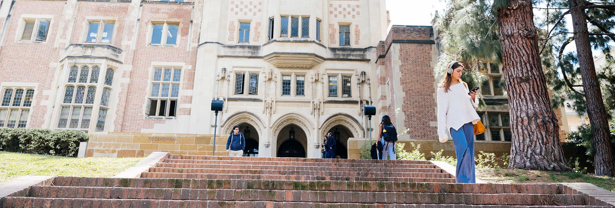 Undergraduates walking on the steps in front of Kerckhoff Hall