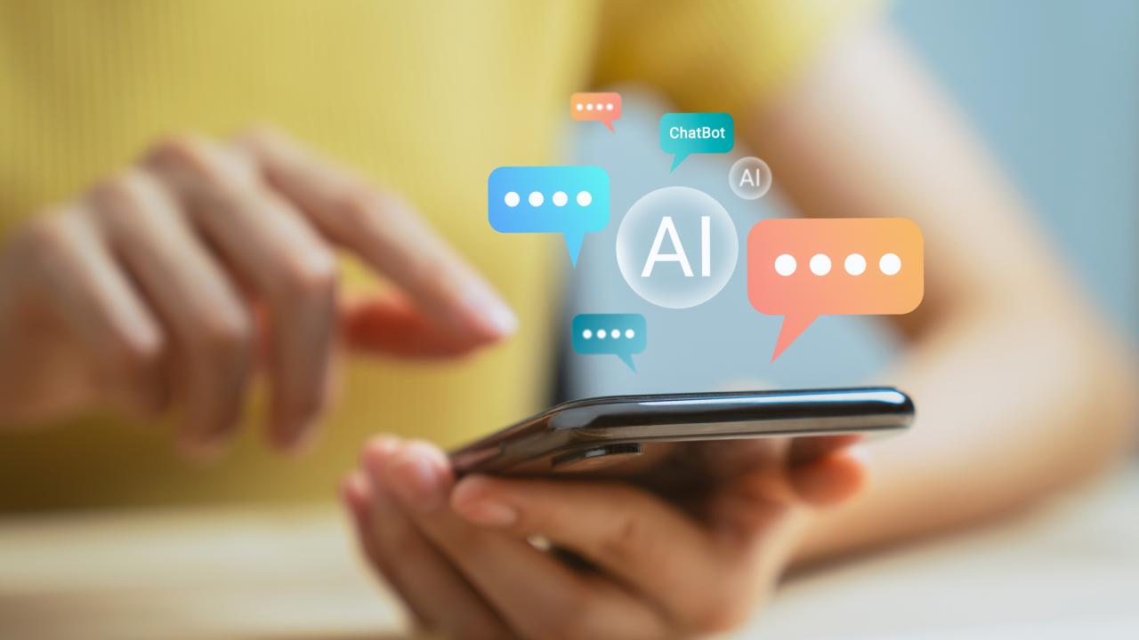 Hand using smartphone and chatting with chatbot application, shows message speech bubbles digital screen of social media notifications.