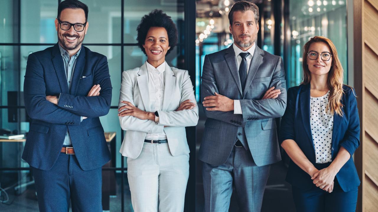 Multiracial group of business people standing side by side in the office