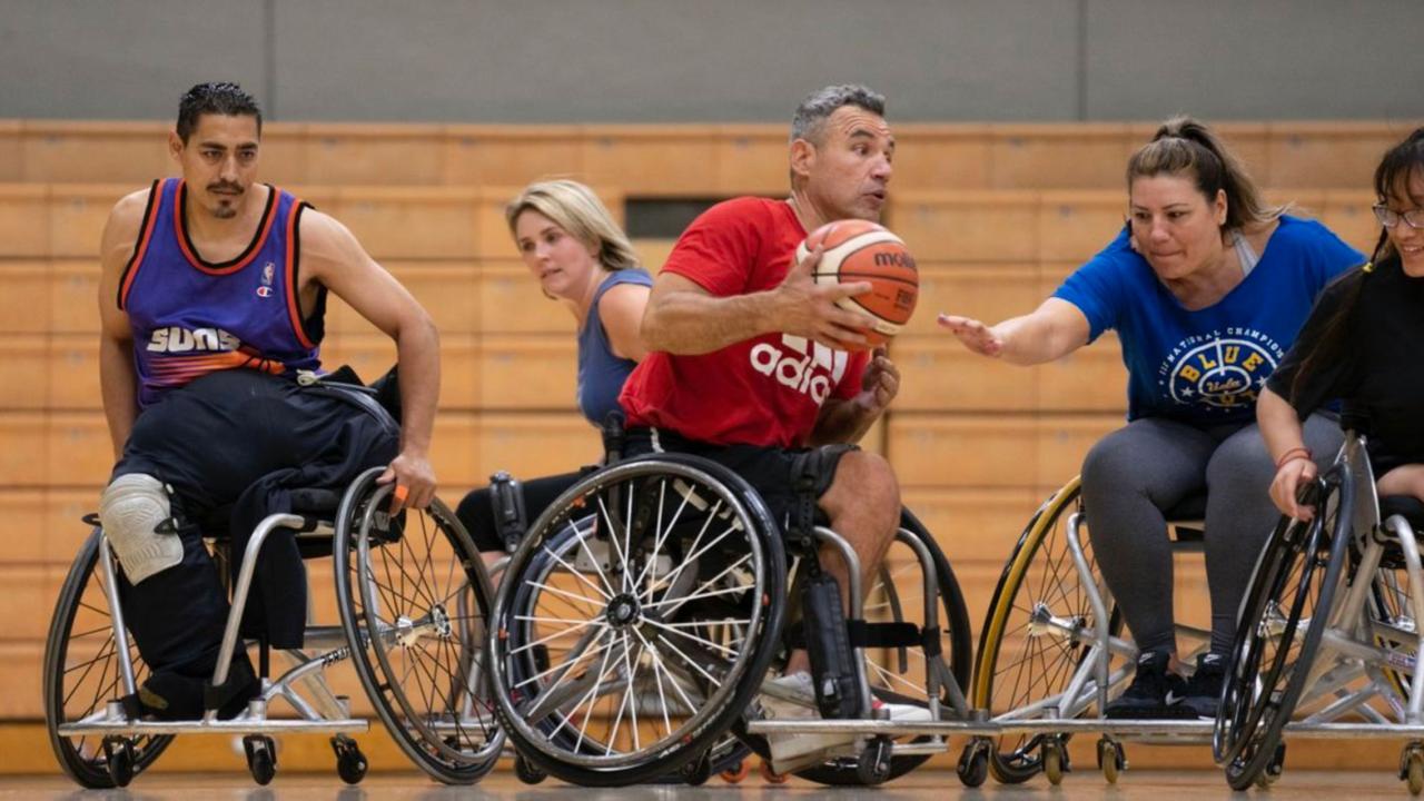Individuals with a disability engage in a pickup game of wheelchair basketball