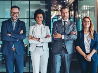 Multiracial group of business people standing side by side in the office