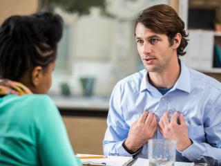 Two employees having a serious conversation