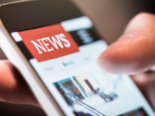 News highlights on a mobile phone screen