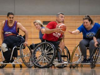 Individuals with a disability engage in a pickup game of wheelchair basketball